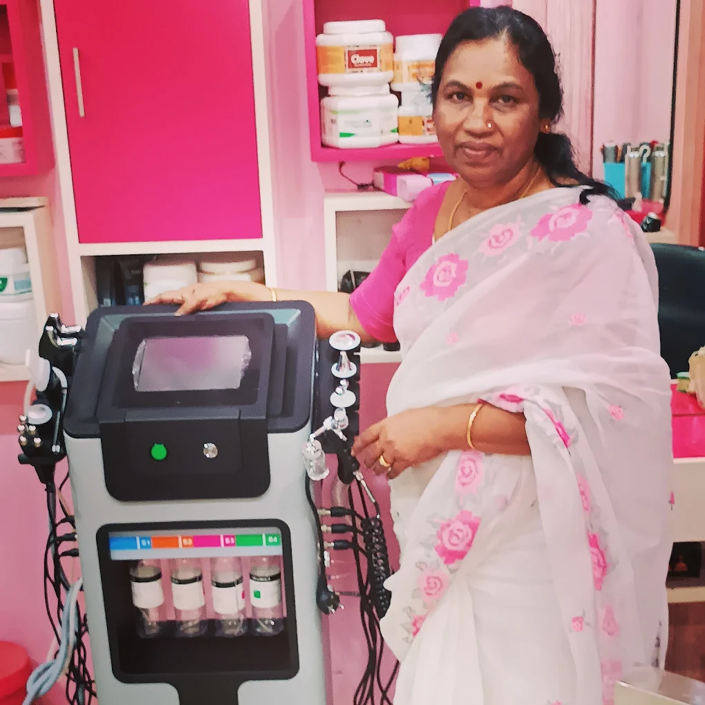 The founder of Rose Herbal Beauty Clinic with the clinic's modern facial equipment
